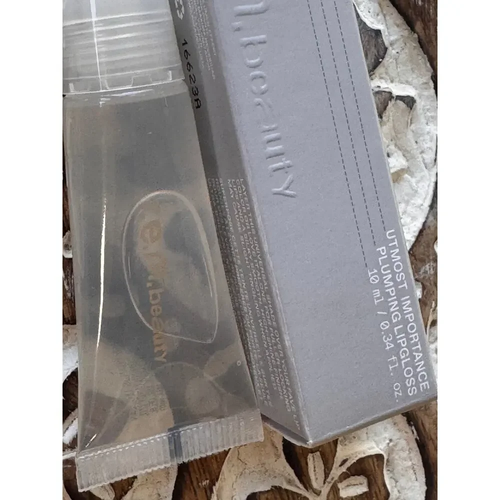 r.e.m. beauty Utmost Importance Plumping Lip Gloss Clear 10 mL Full Size